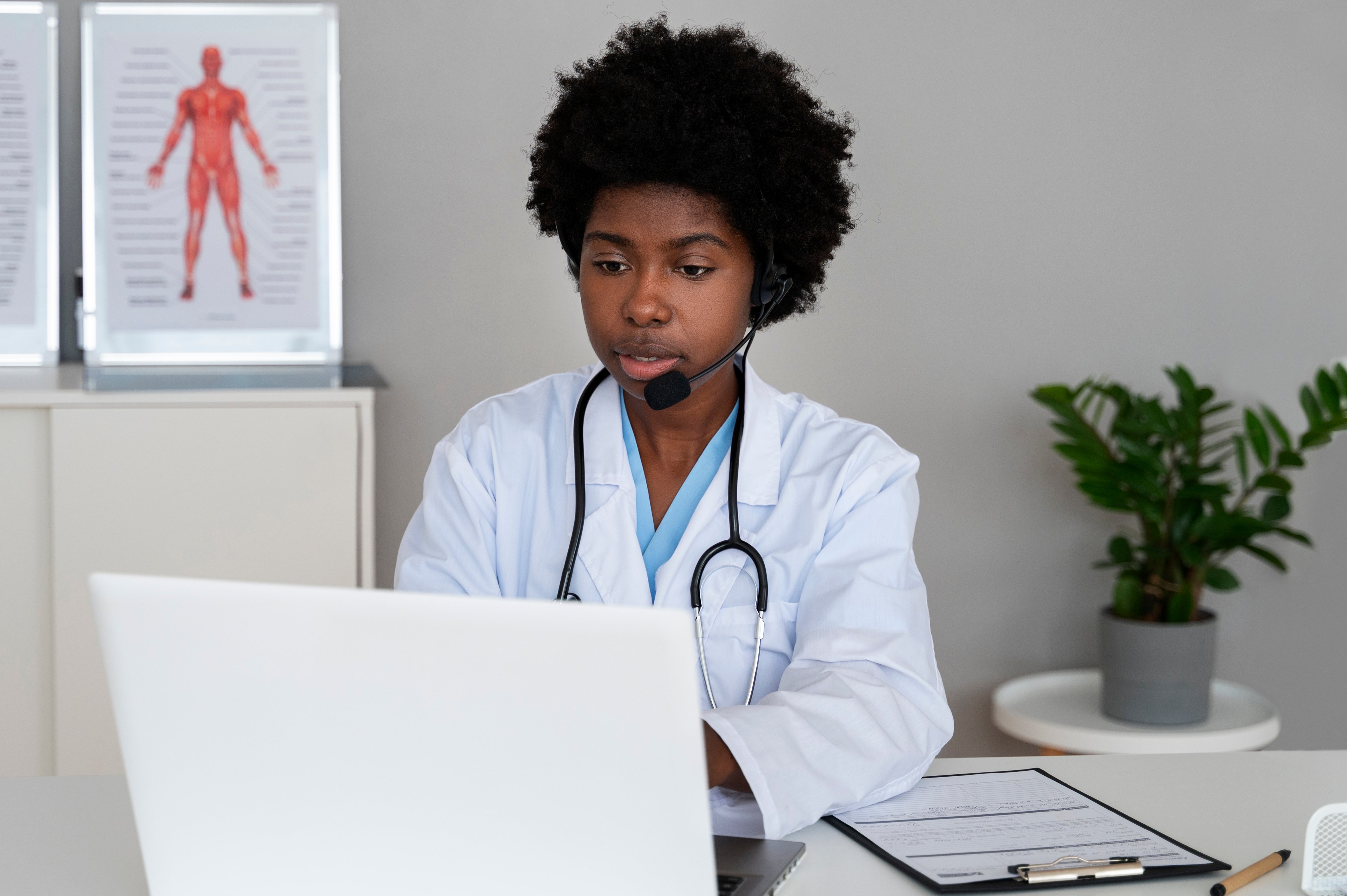 medium-shot-doctor-working-with-laptop