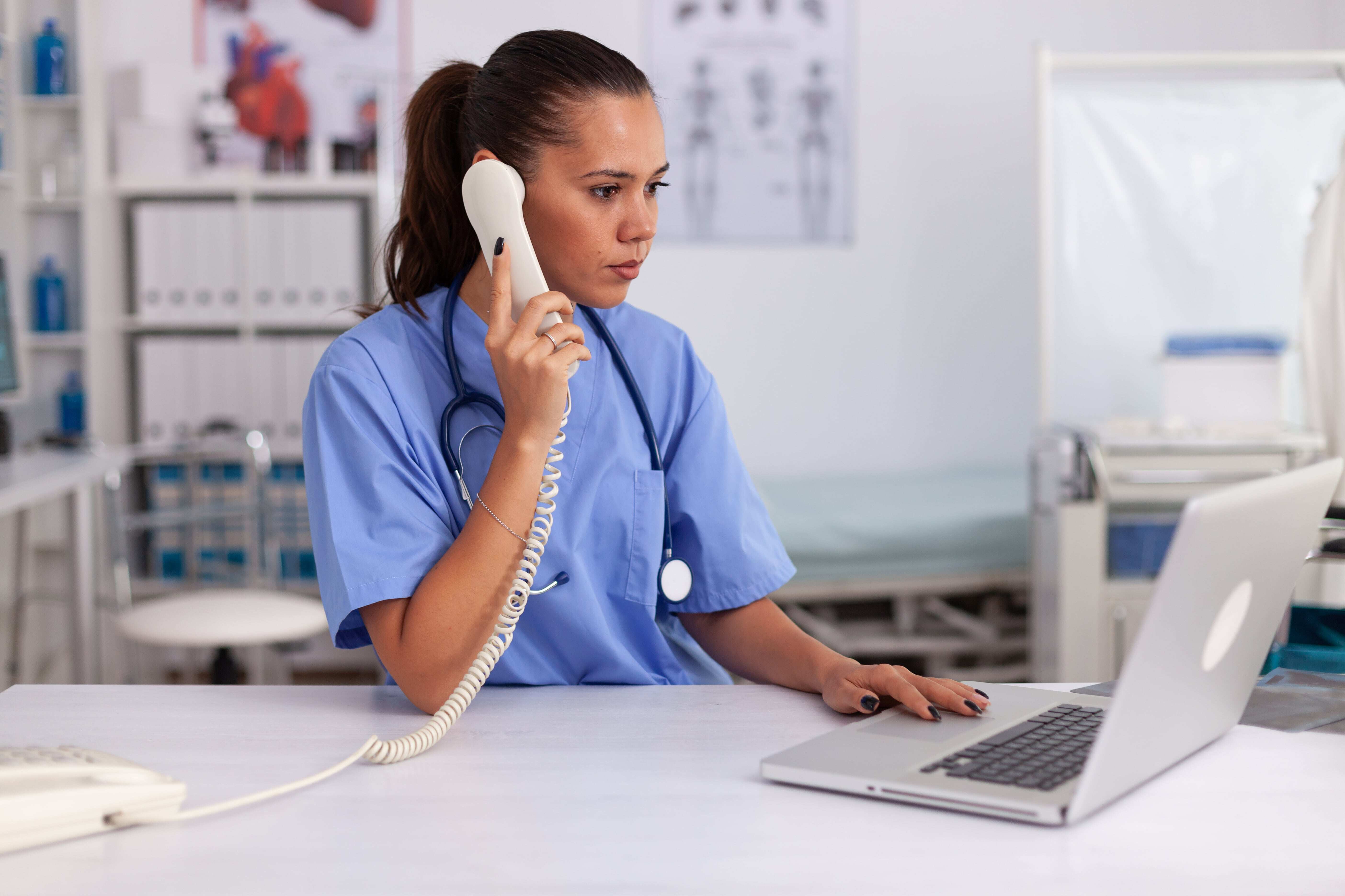 medical-practitioner-answering-phone-calls-min